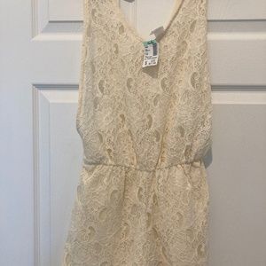 Toska Cream colored Romper lace with top lace no liner with open sides